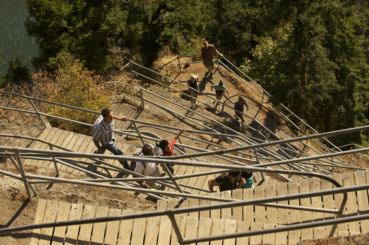 Steven Lane/The Columbian
A steady stream of visitors ascend the trail up Beacon Rock in the Columbia River Gorge National Scenic Area. The inner column of an ancient volcano is the second largest monolith in the world.