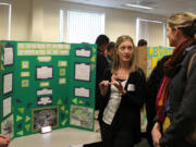 Salmon Creek: Prairie High School sophomores Kelly Pearce, left, and Hailey Miracle, center, present their research during the Mount St.