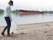 Bonneville Power Administration
Frenchman's Bar: Summer Goodwin, of Bonneville Power Administration, picks up trash along the Columbia River during an April 18 volunteer cleanup event at Frenchman's Bar Regional Park.