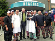 Columbia Way: Popular Mexican comedian Teo Gonzalez, center in coat, poses for photographs during an April visit to Beaches Restaurant. Gonzalez, known for his trademark ponytail, stopped in Vancouver to eat while passing through town on his way to a gig in Seattle.