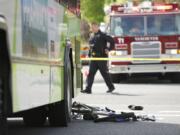 Police investigate an April 28, 2012 accident where a C-Tran bus collided with boy on a bike at the intersection of 27th and Main in Vancouver.