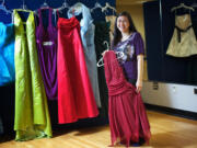 Christina Chen, a senior at Hudson's Bay High School, organizes prom dresses for Saturday's event offering $5 prom dresses to girls attending Vancouver school district high schools.