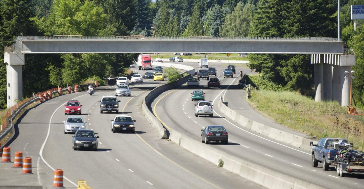 Cars pass beneath the 139th Street overpass on Interstate 5 on Sunday.