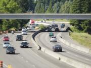 Cars pass beneath the 139th Street overpass on Interstate 5 on Sunday.