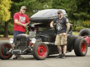 Aaron Showalter, left, and Lenny Cestaro stand next to a chopped 1935 Ford on Tuesday in Vancouver.