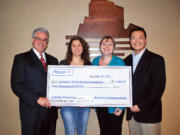 Cascade Park: Riverview Community Bank's Kim Capeloto, from left, and Jennifer Konopasek present a $4,000 donation to Ginny Gronwoldt and Park Llafet of the Evergreen School District Foundation in early March.