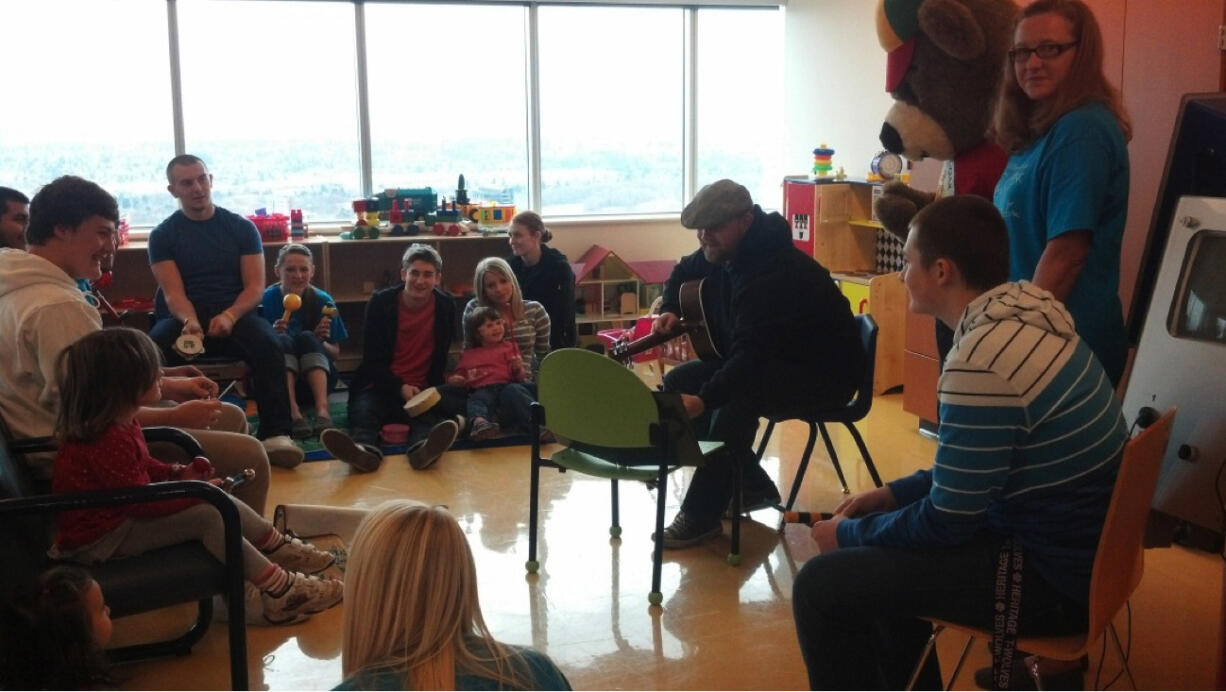 Heritage High School: Volunteers with Owl Be Better With Music share healing tunes with patients at Shriners Hospital in Portland.