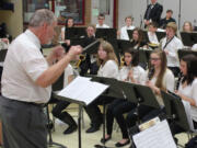 Brush Prairie: Retired music teacher Chuck Bolton, who worked at Sam Barlow High School in Gresham, Ore., conducts a clinic with the Pleasant Valley Middle School band during Battle Ground Public Schools' annual &quot;District Band Day,&quot; held March 7 at Prairie High School.