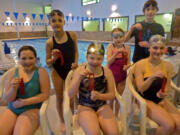 Green Meadows: Club Green Meadows Swim Team kids show off ribbons they earned in the Feb. 22 Kid's Club Fun and Fitness Swim Meet. Front row from left: Sophie Hannon, Darien Walton and Hannah Weinberg.