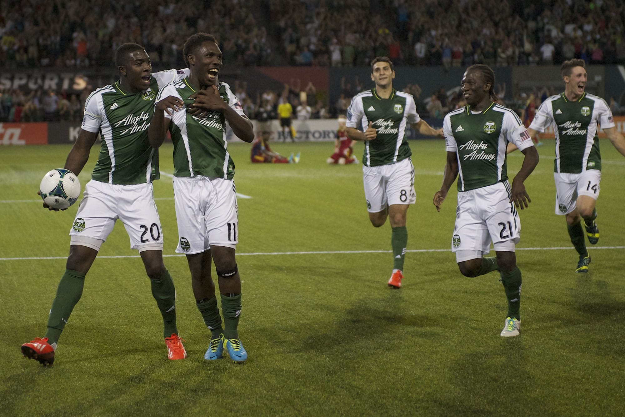 Jose Valencia, left, congratulates Kalif Alhassan, number 11, after Alhassan scored a goal in the second half against Real Salt Lake on Wednesday.The game ended a tie 3-3.