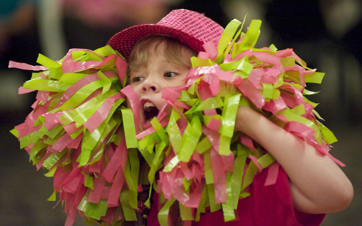 Olivia Petersen, 10, has fun with pompoms at a recent rehearsal for performance team DANA's Dreamers.