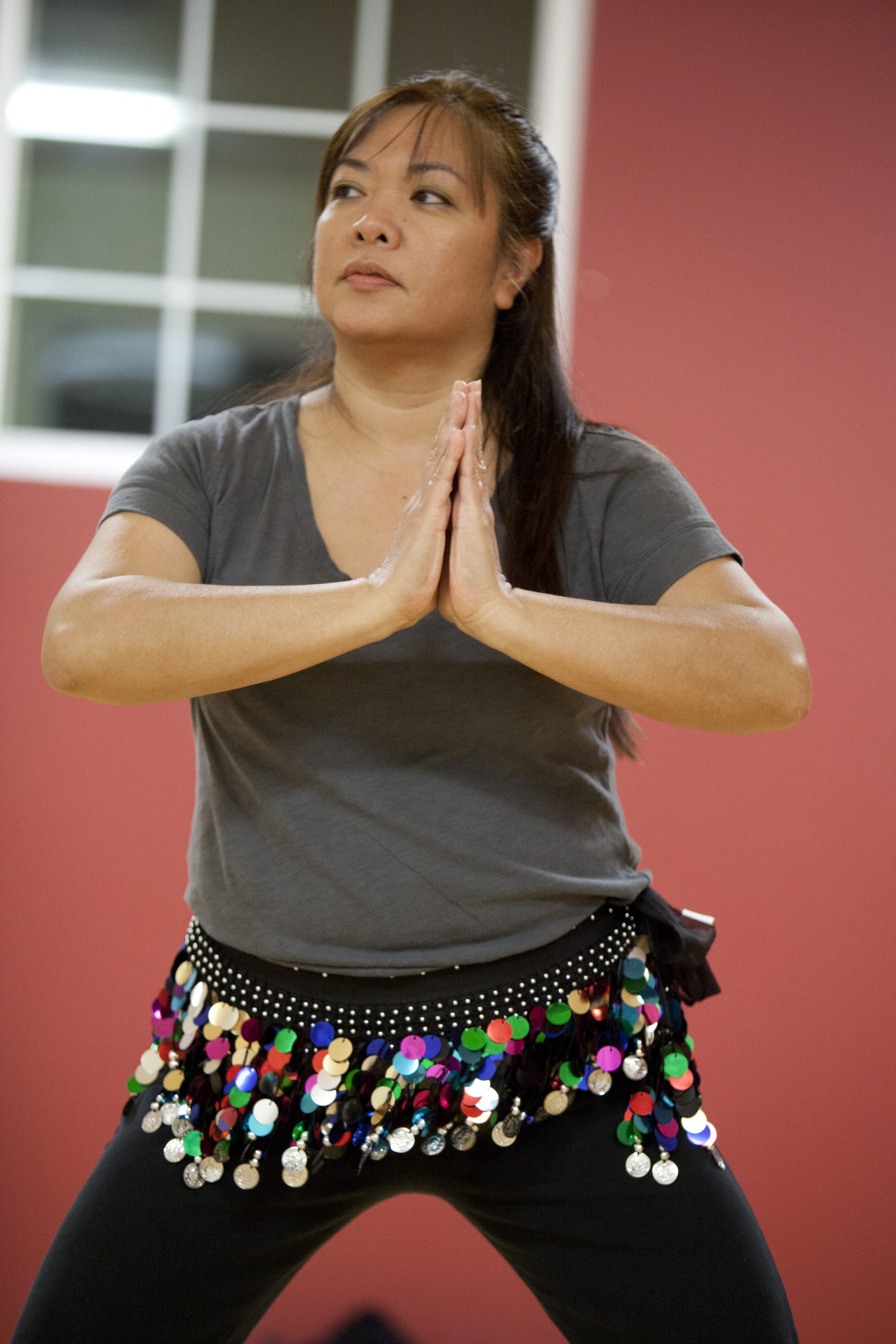 Edel Verzosa follows the instructor's moves during her first Bellyfit class Wednesday evening at Fit on 1st in Vancouver.