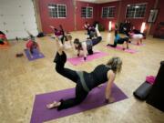 Marlainna Renton leads the end of Wednesday's Bellyfit class with core-focused Pilates moves.