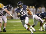 Jabari Marshall, 33, of Skyview High School scores a touchdown in the first half against Columbia River High School at Kiggins Bowl Friday September 7, 2012 in Vancouver, Washington.