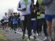 Runners compete in the annual Vancouver Lake Half Marathon at Vancouver Lake Park on Sunday.