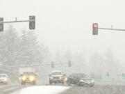 Motorists merge onto Interstate 5 south from Northeast 134th Street during heavy snow Feb.