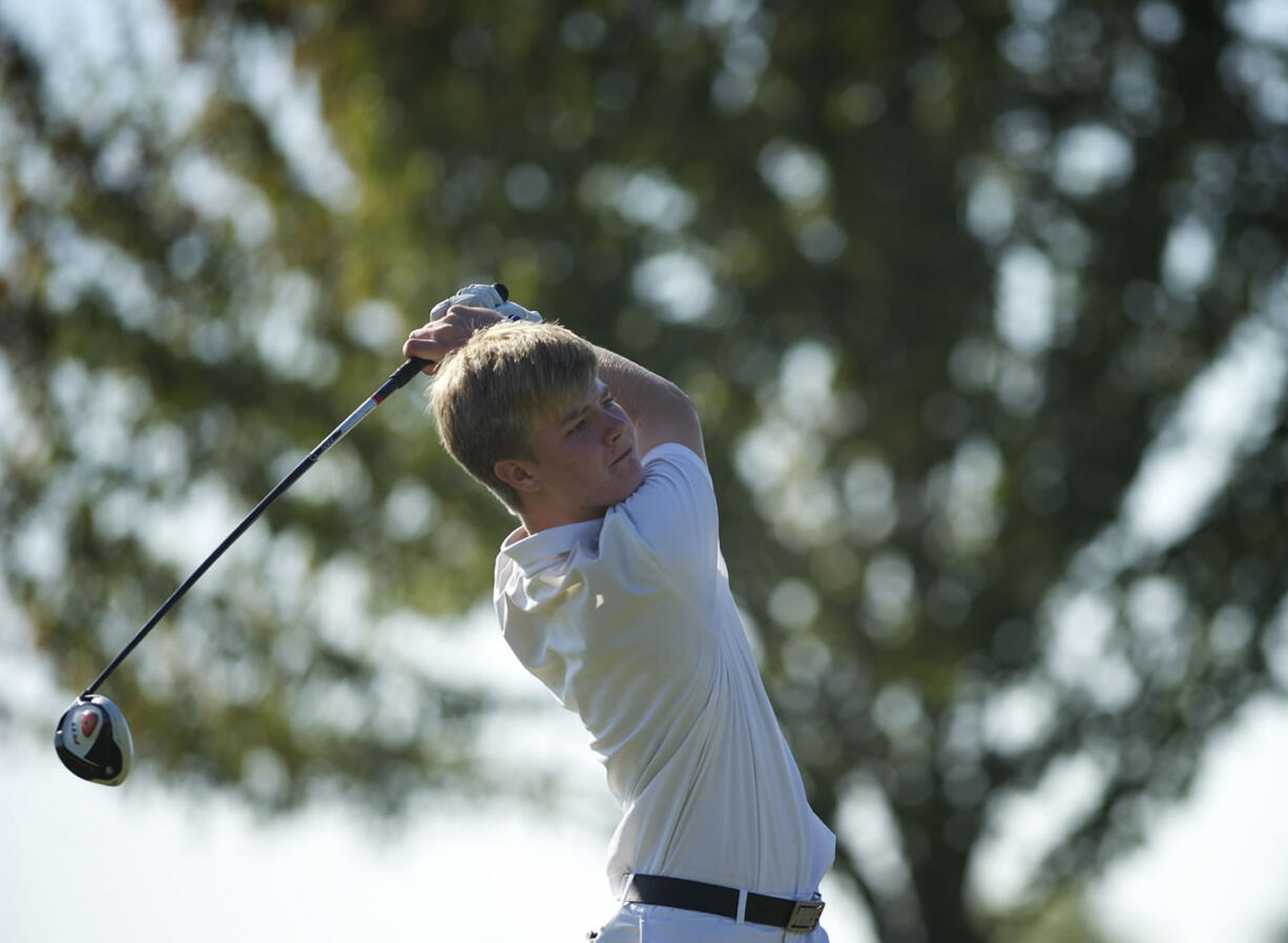 Fort Vancouver's Trent Standard hits off the 18th tee Tuesday during the final day of the 3A district golf tournament at Tri-Mountain Golf Course.