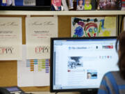 Reporter Stephanie Rice -- part of a team of Columbian bloggers -- displays 2012  EPPY awards for political blogging at her desk.