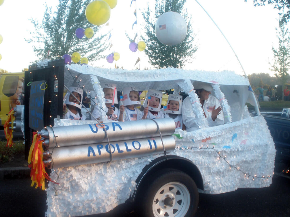 La Center: During La Center's Our Days Twilight Parade, the historic Apollo 11 moon landing was commemorated by Fabiola Rico Castillo, from left, Dayne Cobb, Austin Cobb, Aiden Donowitz, Owen Donowitz and Sherree Filla of the Modern Woodmen of America's Youth Service Club.