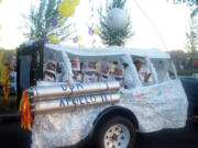 La Center: During La Center's Our Days Twilight Parade, the historic Apollo 11 moon landing was commemorated by Fabiola Rico Castillo, from left, Dayne Cobb, Austin Cobb, Aiden Donowitz, Owen Donowitz and Sherree Filla of the Modern Woodmen of America's Youth Service Club.