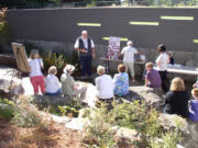 Fircrest: Lance Thompson of the Friends of Cascade Park Community Library welcomes guests to a celebration of the finished courtyard landscape.