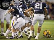 CLAYTON FRANK, 9, OF COLUMBIA RIVER HIGH SCHOOL loses his helmet as he is tackled during a game against Skyview High School AT KIGGINS BOWL FRIDAY SEPTEMBER 7, 2012 IN VANCOUVER, WASHINGTON.