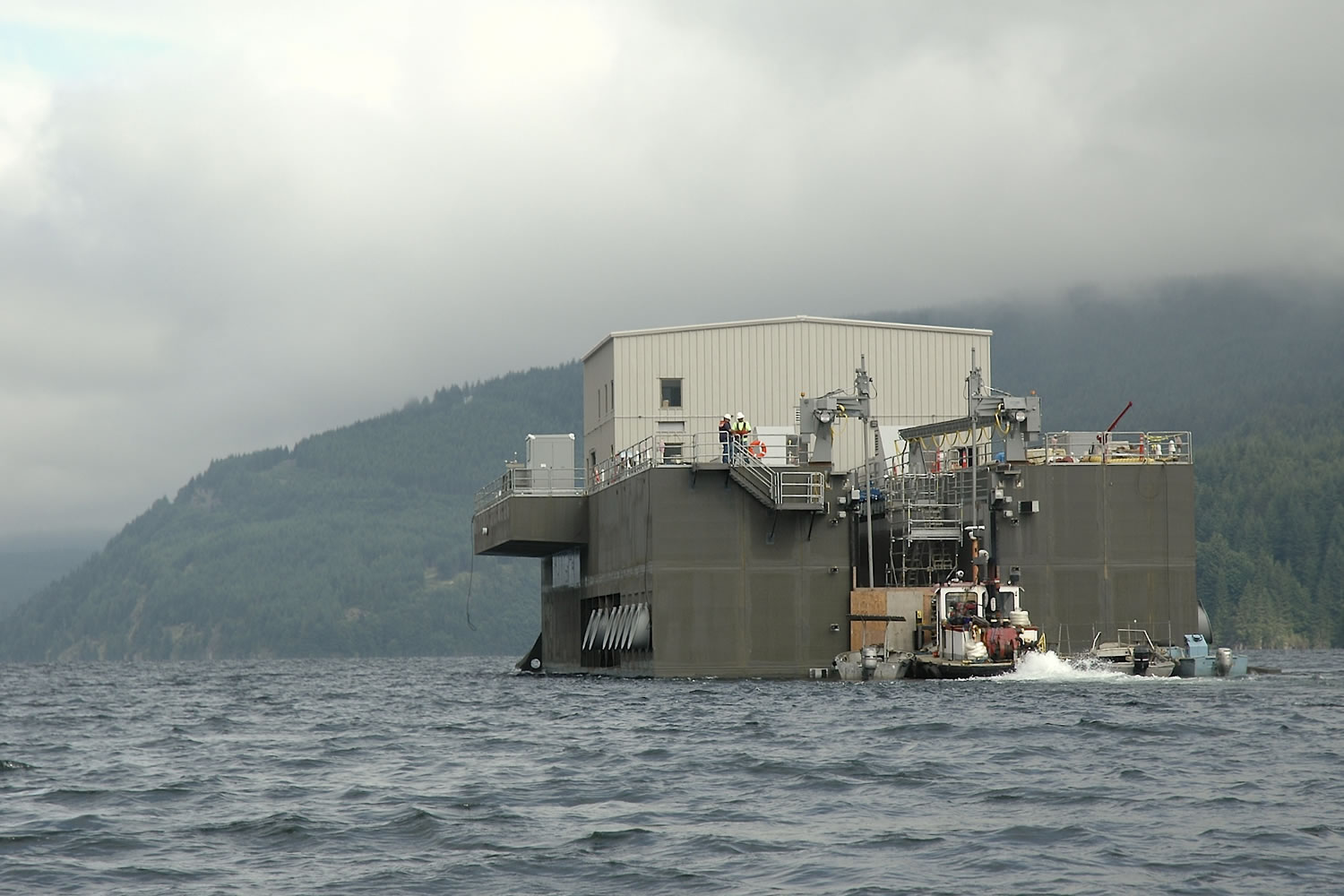 AlLEN Thomas/The Columbian
The $60 million Swift fish collector being towed from Swift Forest Camp to the permanent location at Swift Dam. Facility is 170 feet long, 60 feet wide, 53 feet tall and weighs 3 million pounds.