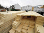 Stacks of lumber sit at a construction site in Canonsburg, Pa.