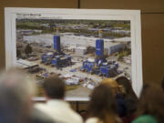 A photograph displayed  at Tuesday's CRC hearing shows oil rigs built by Thompson Metal Fab, which their executives say will be too large to cross underneath the proposed new bridge.