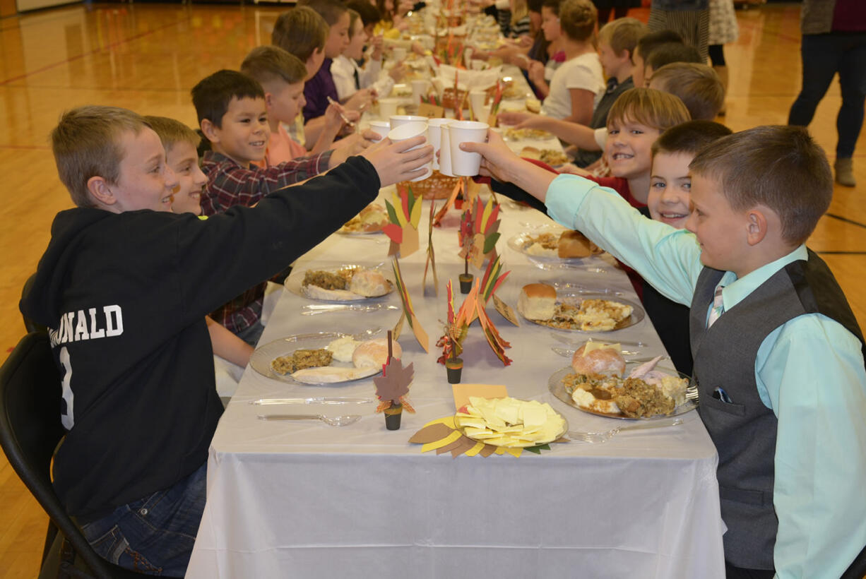 Washougal: Cape Horn-Skye Elementary School fifth-graders enjoy their feast to culminate their month-long Gratitude Challenge, in which they wrote holiday letters to troops, recognized important role models in their lives and kept a thankful journal.