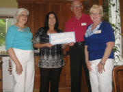 Esther Short: Newcomers Club members Gladys Green, left, and Karen Roark, far right, present a check to Dawn Barton and Michael Bacon of Open House Ministries.