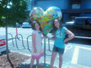 Seven-year-old Quinn, left, and 10-year-old Sierra Perea went on a local art hunt with their grandmother this summer.