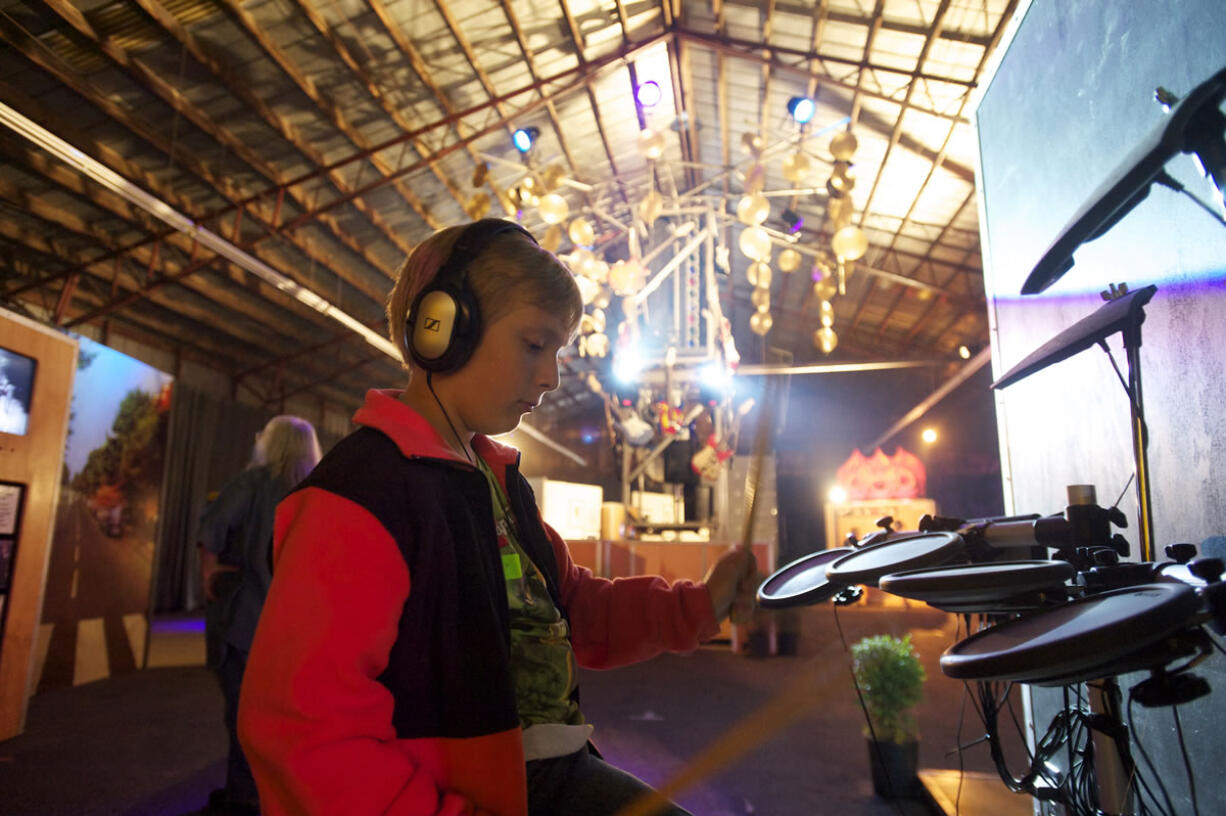 Sebastian Maher, 10, from Vancouver, plays the electric drums at the Rock U exhibit at the Clark County Fair on Friday. Balancing new technology and urban life with agricultural roots is a constant challenge at the Clark County Fair.