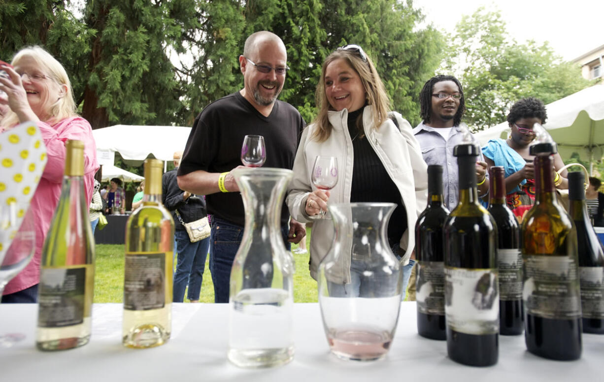 Joe and Michele Stilger of Vancouver sample offerings from Moulton Falls winery at the Craft Winefest of Vancouver on Sunday.