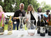 Joe and Michele Stilger of Vancouver sample offerings from Moulton Falls winery at the Craft Winefest of Vancouver on Sunday.