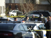 Police investigate a fatal shooting involving undercover police officers Friday January 18, 2013 at the Addison Apartments in Vancouver, Washington.