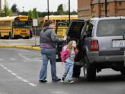 Shelley Cole drops  daughter Bailey Cole, 6, off at Felida Elementary School -- home of the Falcons -- in May 2011 in Vancouver.