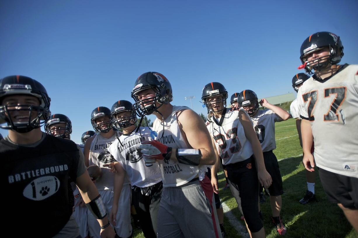 Battle Ground's Kevin Haynes, center, had a big supporting cast last Friday as the offensive line opened the holed that helped the running back gain 316 yards against R.A.