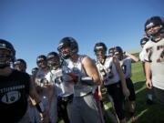 Battle Ground's Kevin Haynes, center, had a big supporting cast last Friday as the offensive line opened the holed that helped the running back gain 316 yards against R.A.