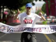 Vancouver resident Youssef Zirari runs away with the Vancouver USA Marathon title in 2 hours, 34 minutes, 25 seconds on Sunday.