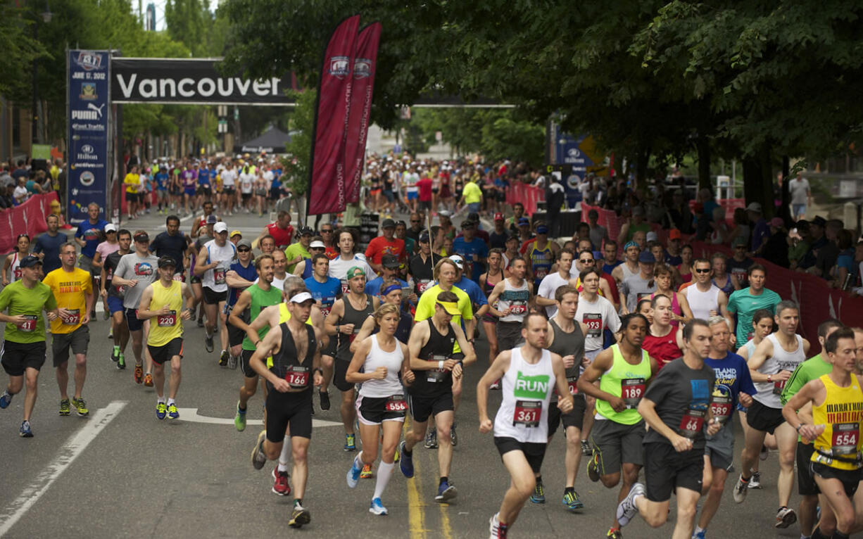 Runners begin the 2012 Vancouver USA Marathon in downtown Vancouver on Sunday morning.