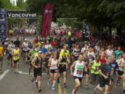 Runners begin the 2012 Vancouver USA Marathon in downtown Vancouver on Sunday morning.