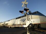 An Amtrak train crosses Southeast 147th Avenue at Southeast Evergreen Highway on Monday.