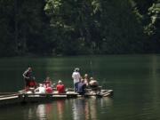 Fishermen fill the dock at Battle Ground Lake State Park on Thursday.