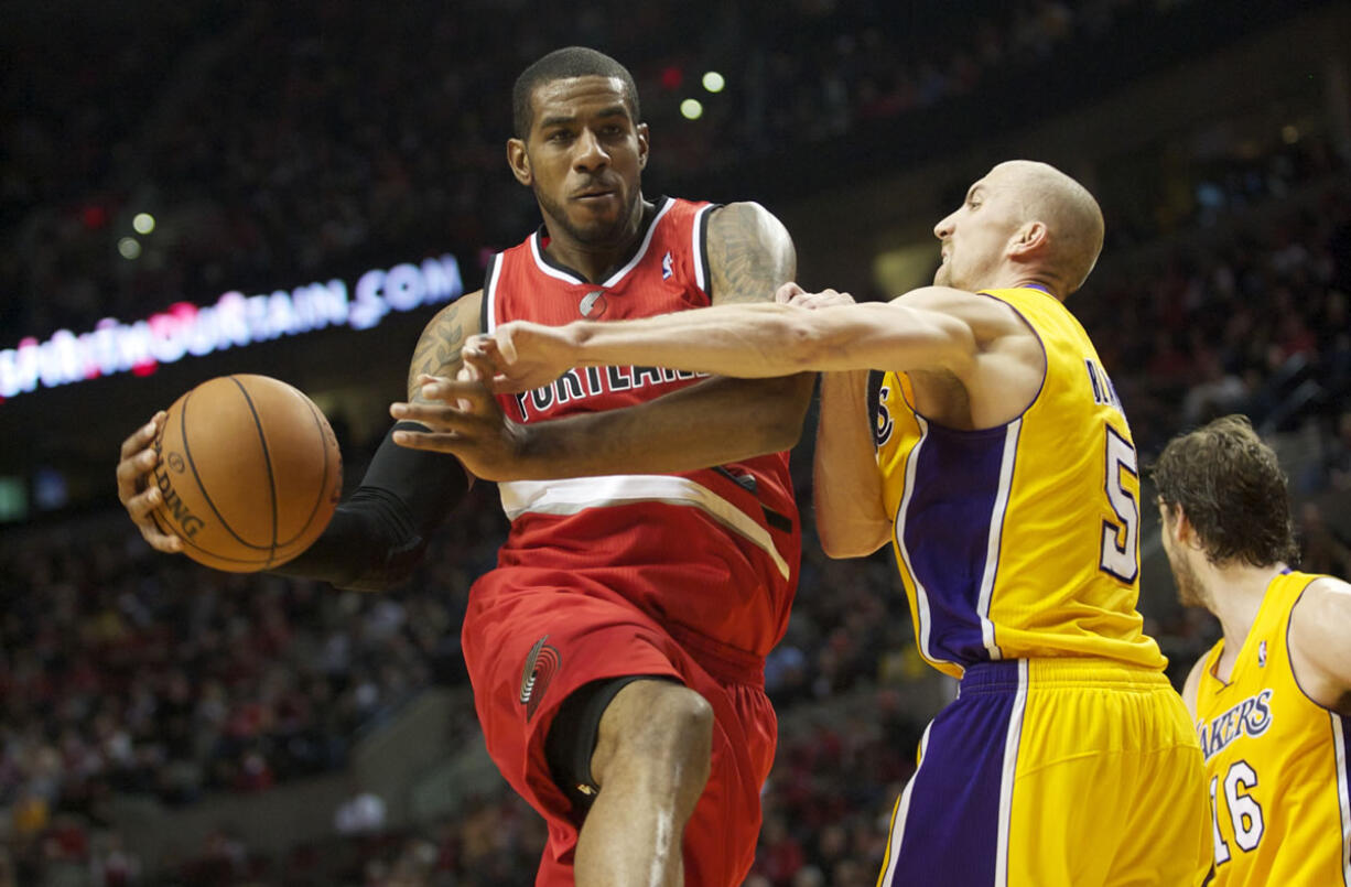 Portland Trail Blazers LaMarcus Aldridge drives against Los Angeles Lakers Steve Blake, Wednesday, October 31, 2012.(Steven Lane/The Columbian)