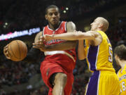 Portland Trail Blazers LaMarcus Aldridge drives against Los Angeles Lakers Steve Blake, Wednesday, October 31, 2012.(Steven Lane/The Columbian)