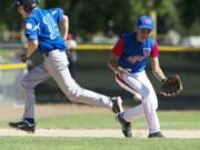 Columbia Little League's Jacob Olivarez fields a ball at third and makes the throw to first for the out against Manhattan Beach in the opening game of the Junior League Western Regional at Propstra Stadium on Tuesday.