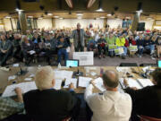 Chris Clifford, center, makes an impassioned appeal to politicians at a state transportation forum Monday in Vancouver to not raise taxes.