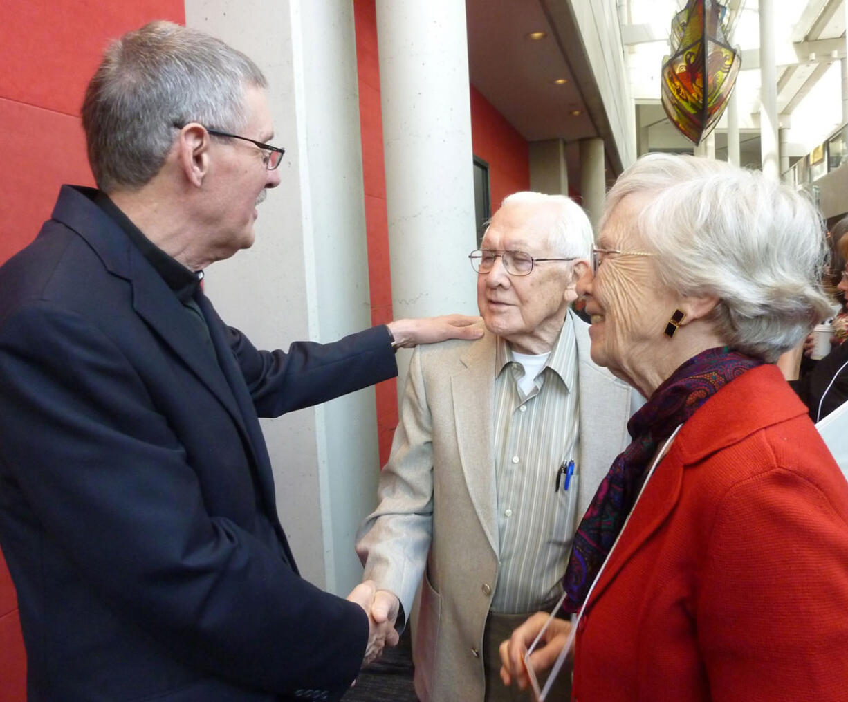 Vancouver's Rev. Rick Jaech, left, greets the Rev.