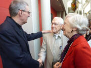 Vancouver's Rev. Rick Jaech, left, greets the Rev.